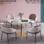 TE1531-08E-ECO-19A-F-bo-ban-tron-tiep-khach-showroom-mat-da-van-may-chan-inox-4-ghe-boc-nem.png